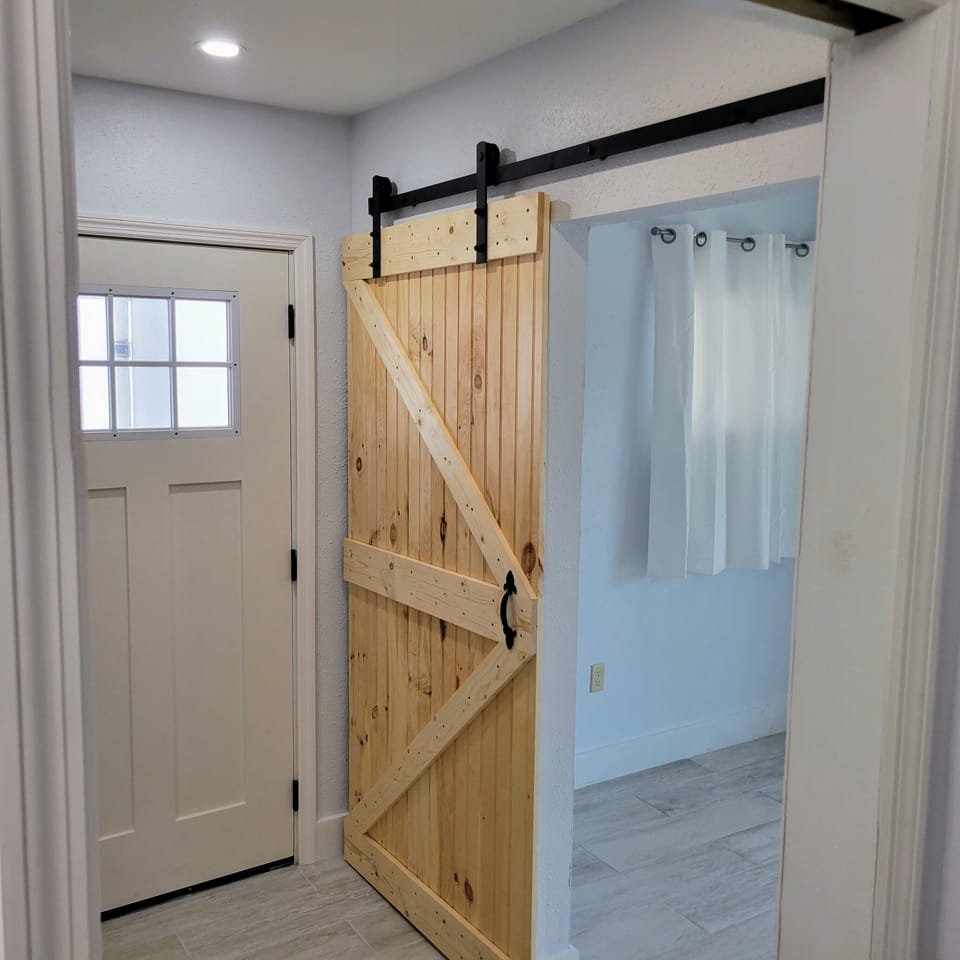 Downstairs Under home side entry, custom barn door, entire lower level is brand 