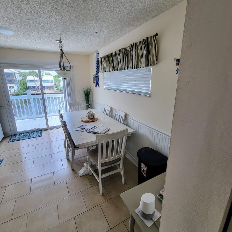 Kitchen with direct water view, new table, new cookware, new flatware