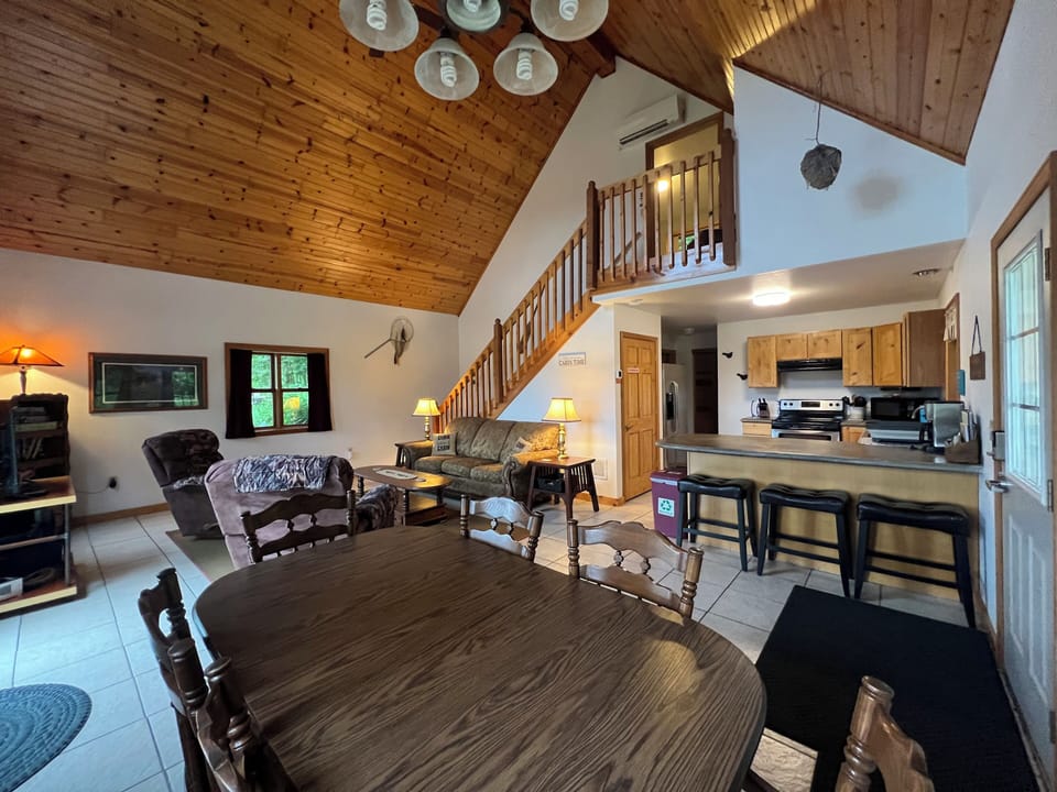Dinning room with seating for 6 plus barstools at the counter