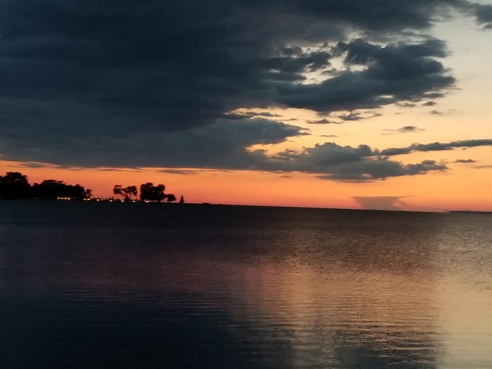 Olsons Point is on the west side of the harbor at sunset.