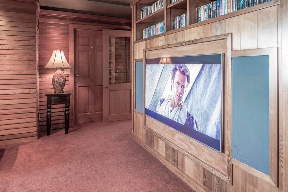 Big-Screen TV in the den, along with extensive movie and music library.