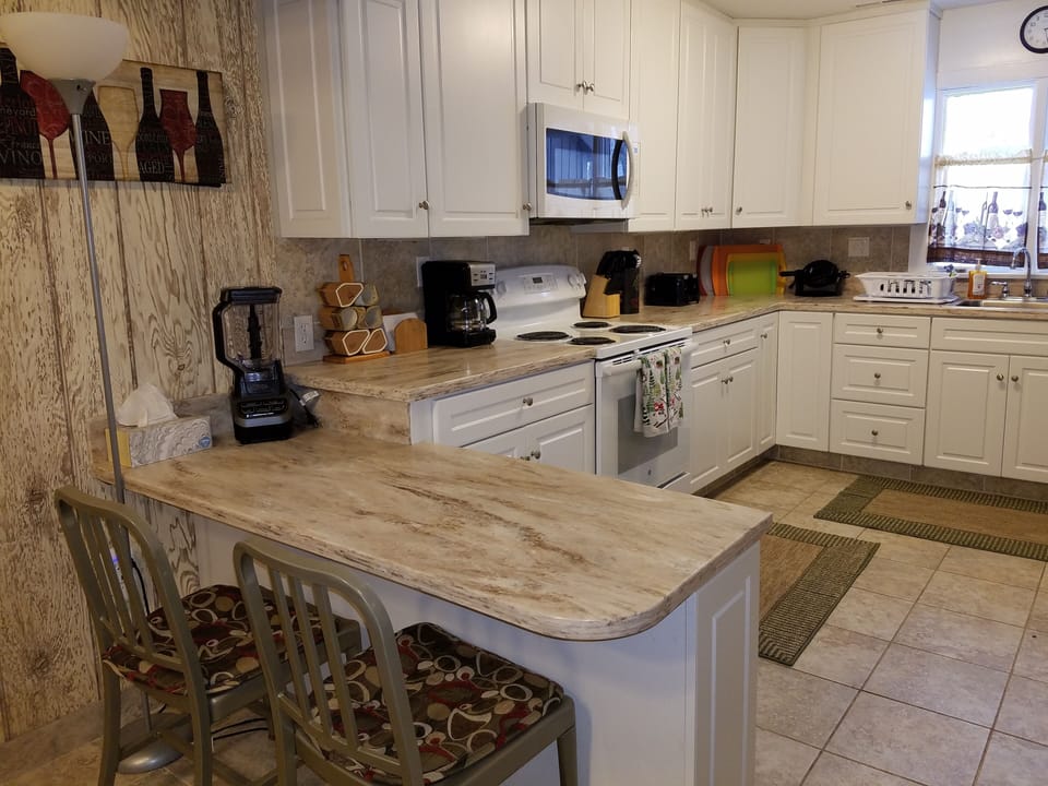 Spacious newly remodeled kitchen!  Breakfast bar with extra seating.  