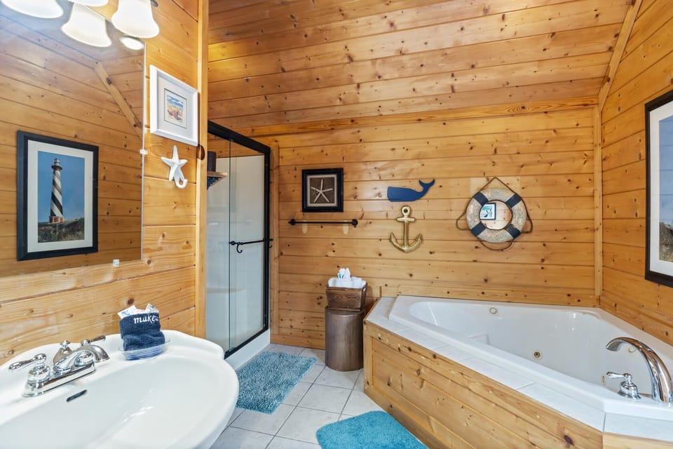 Master bathroom with walk-in shower and jacuzzi.
