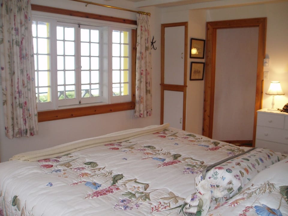 Relaxing first floor Master Bedroom & full bath with View of the Bras d'Or Lakes