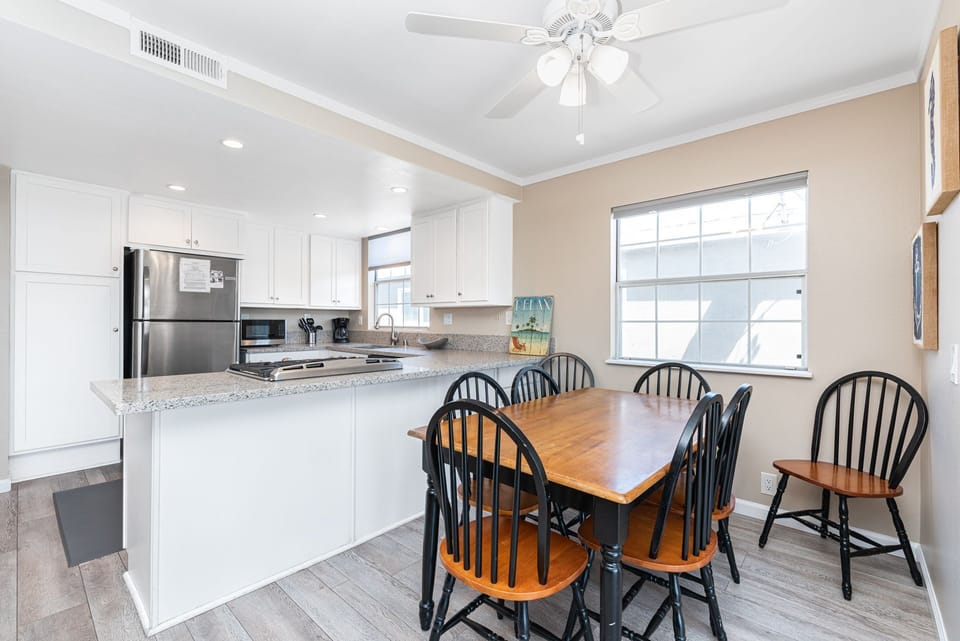 Dining area, adjacent to both kitchen and living areas, is the perfect headquarters for family meals, game night and good conversation.
                