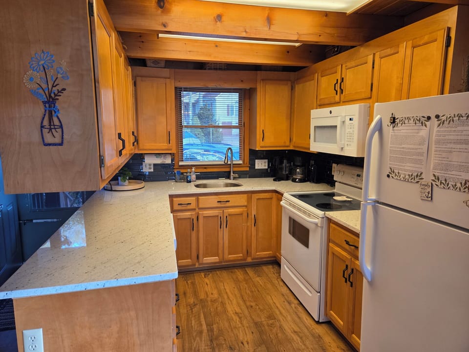 Kitchen is fully stocked, dishwasher, microwave, refrigerator w/ ice maker, etc.