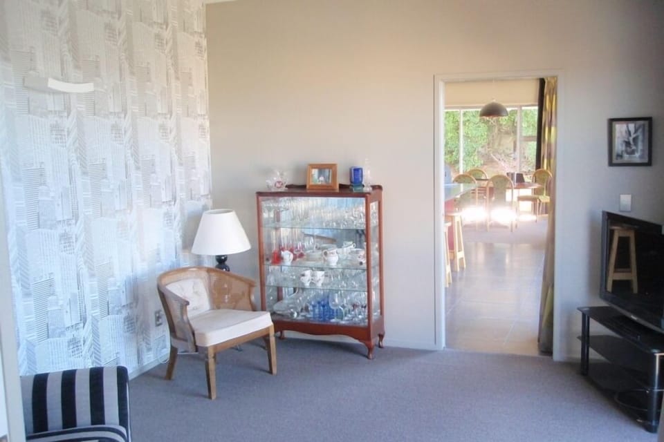 Snug lounge looking towards kitchen and dining
