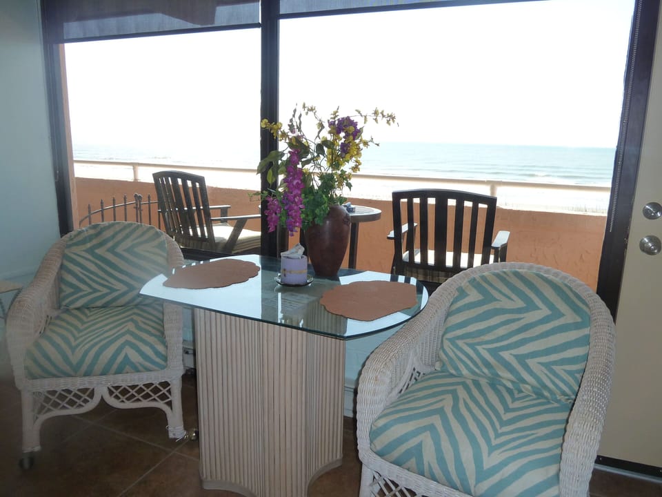 Dinning area with view of Balcony and Ocean