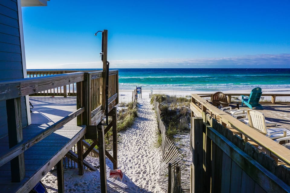 Boardwalk steps from our door to private beach