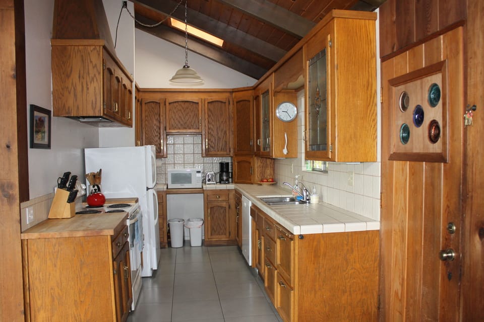 The kitchen is fully equipped for cooking, adjacent to the dining room.