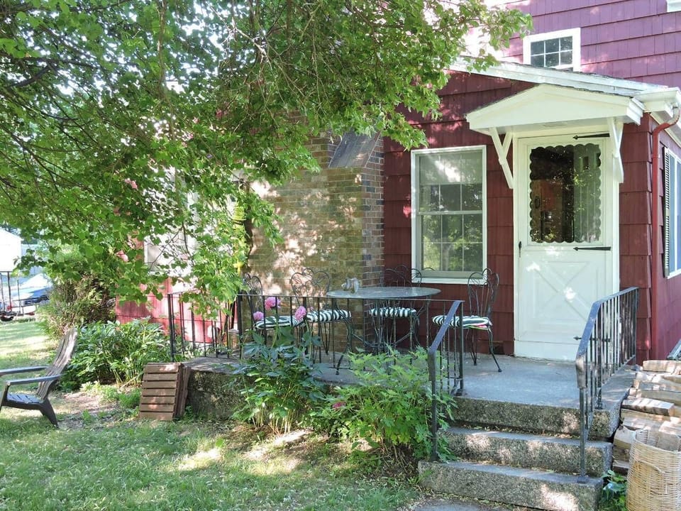 Porch facing large lawn