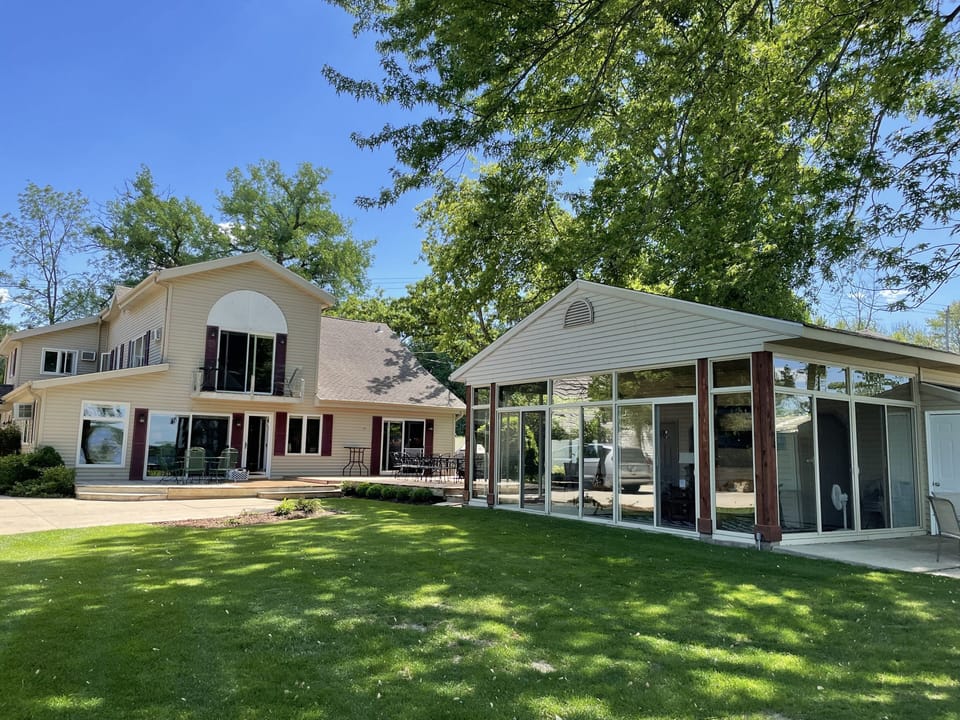 Main house with screened & glass sunroom. The sunroom is not climate contolled. 