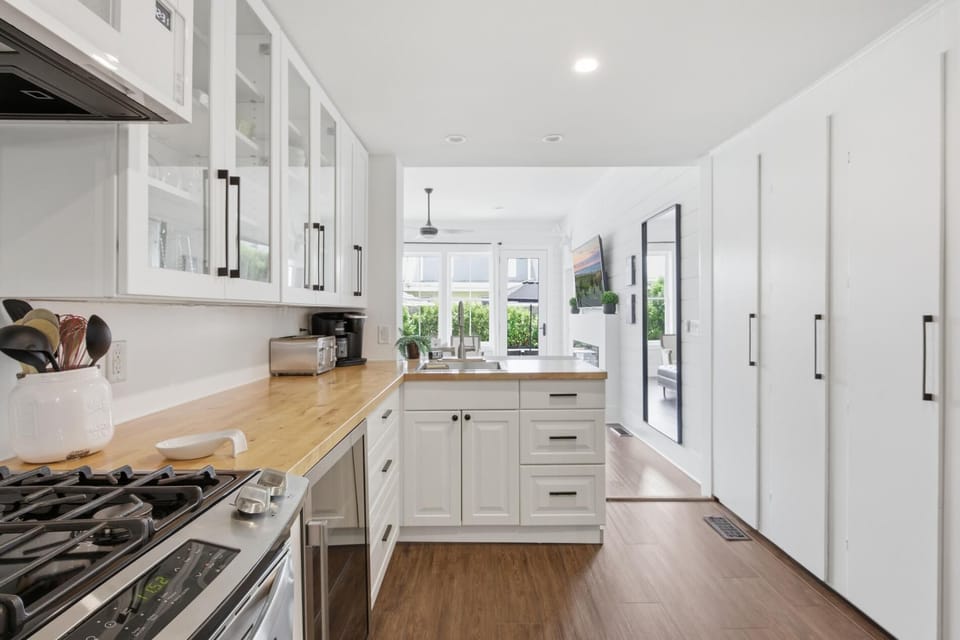 New upper cabinets, cabinet pulls and handles, microwave and beverage refrigerator installed Spring 2026.