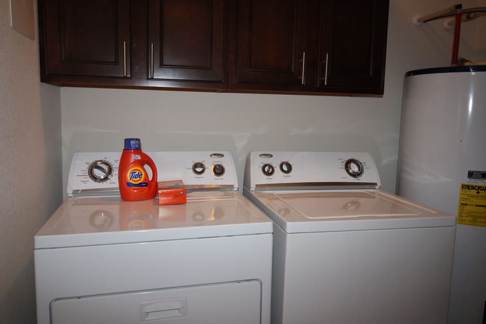 Full Size Washer and Dryer in Hallway Equipment Closet