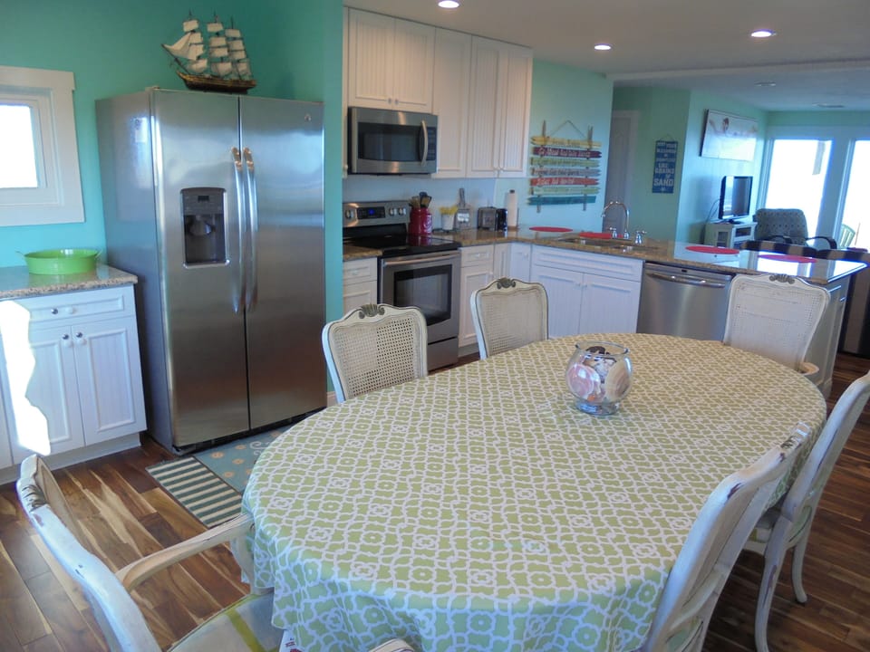 Enjoy meals and an ocean view with family and friends from our spacious kitchen.