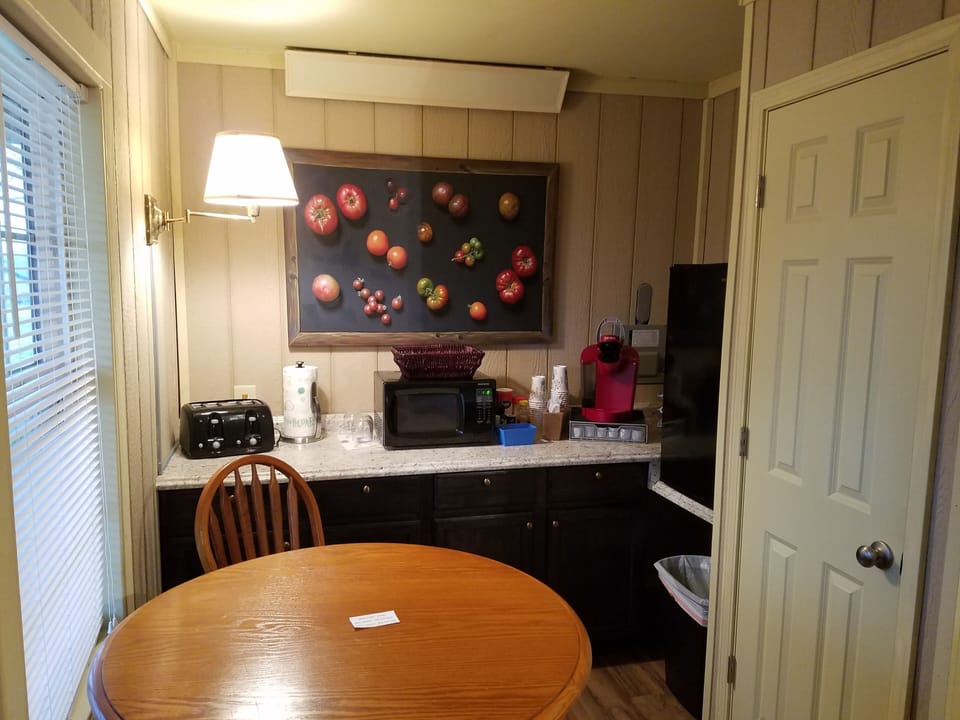 Kitchenette which includes: microwave, toaster, Keurig and Refrigerator.