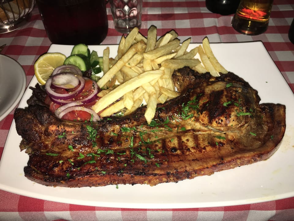 Giant Pork Chop at the Local Taverna, Sunset Restaurant