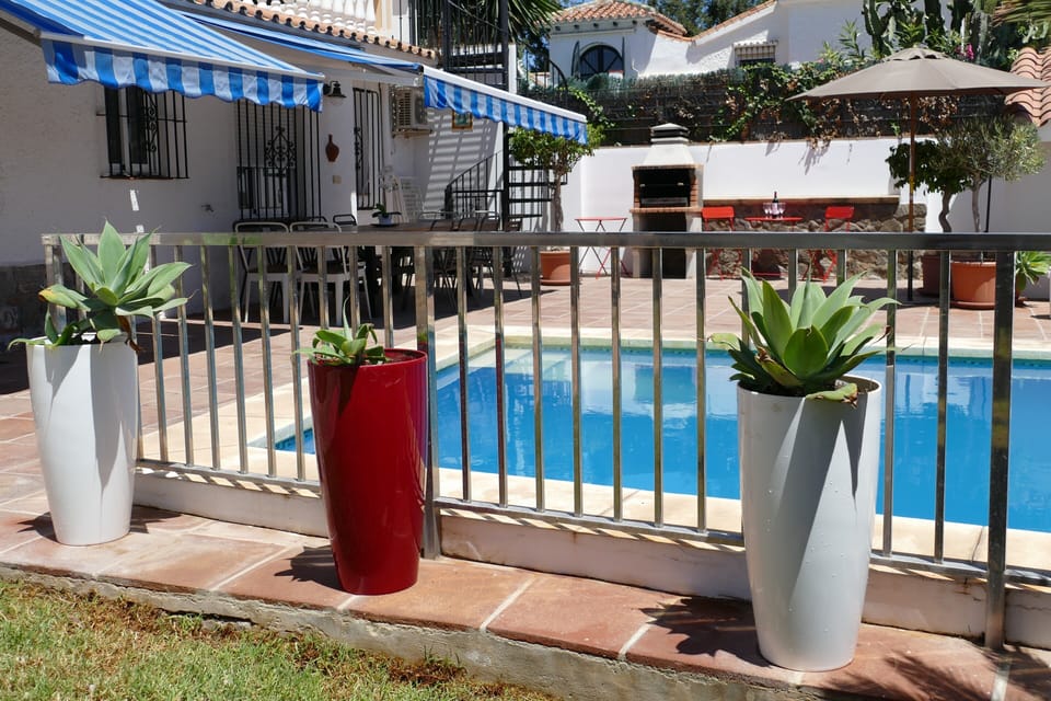 Pool area is fenced for safety.