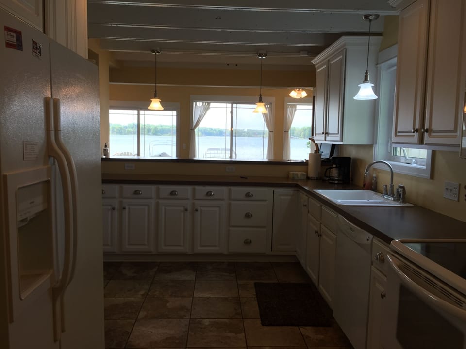 Fully stocked kitchen, dishwasher, oven, micro and fridge w/ filtered water/ice.