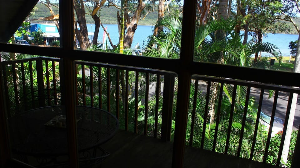Private upstairs covered deck overlooking the lake.