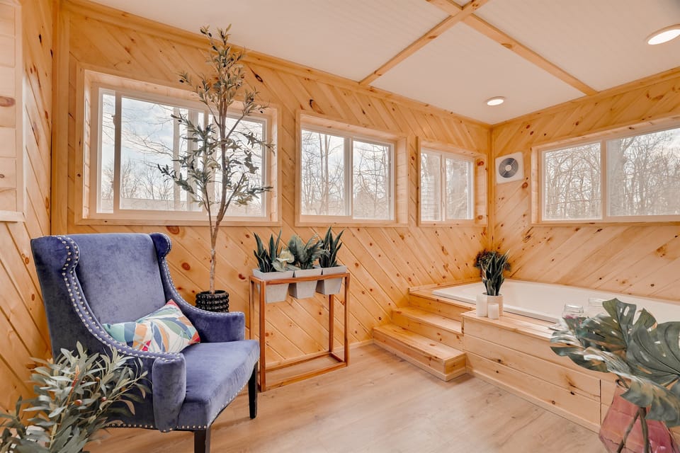 Master Bedroom Spa Room - Featuring a large soaker tub surrounded by windows, this serene space is ideal for bird watching or soaking in the sounds of nature.