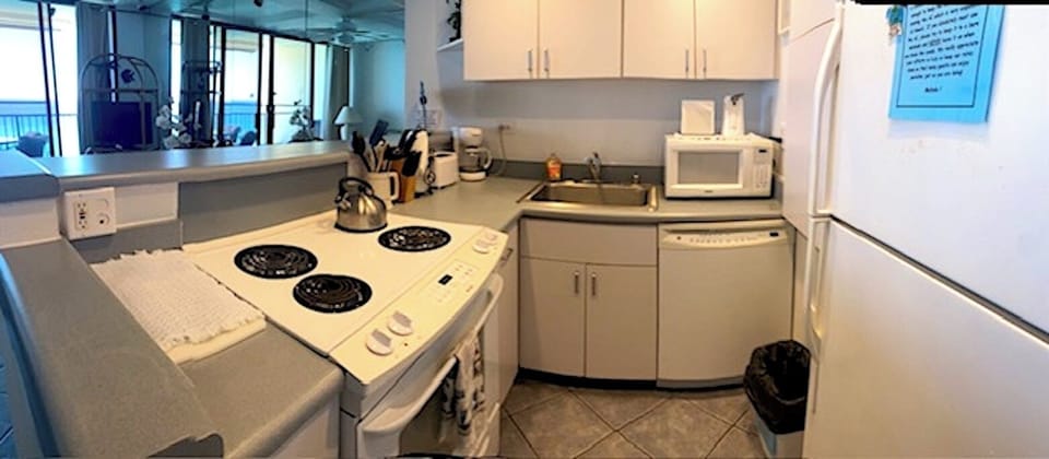 FULLY FURNISHED KITCHEN W/FRIDGE ICEMAKER  SHOULD YOU DECIDE TO WHIP UP A MEAL!