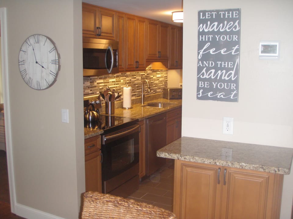 View of Desk/Bar and into the galley Kitchen