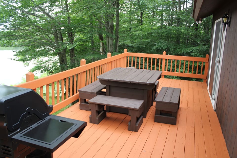Right off the eat in kitchen, 10x20 deck with grill and dining table for 10+.