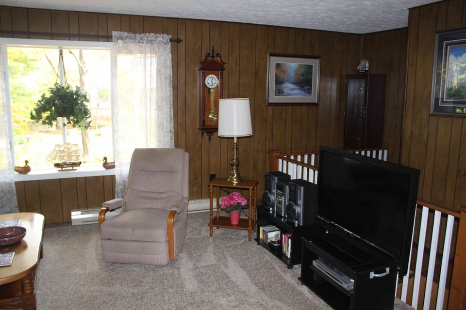 Living Room with smart tv/radio & music/cd library.  Room is on the 2nd floor.