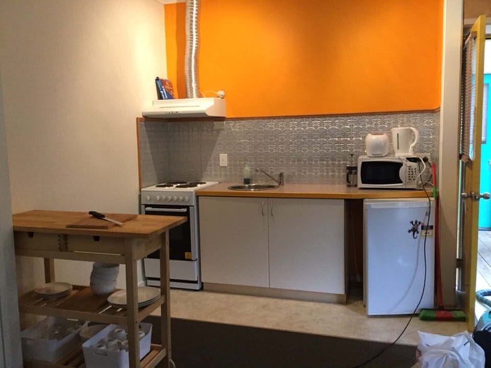 Equiped Kitchenette with full stove and oven, microwave, toaster, etc.