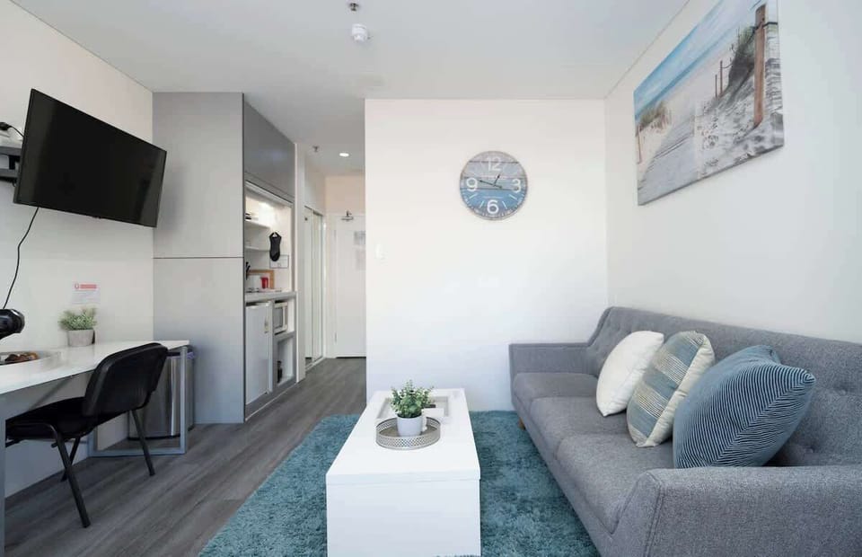Experience modern living designed for your convenience. This inviting studio offers a relaxed lounge area, a productive desk space, and a handy kitchenette for easy living.