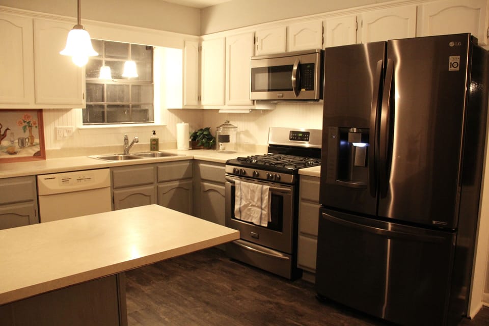 Frigidaire Gallery oven & microwave with black stainless LG fridge.