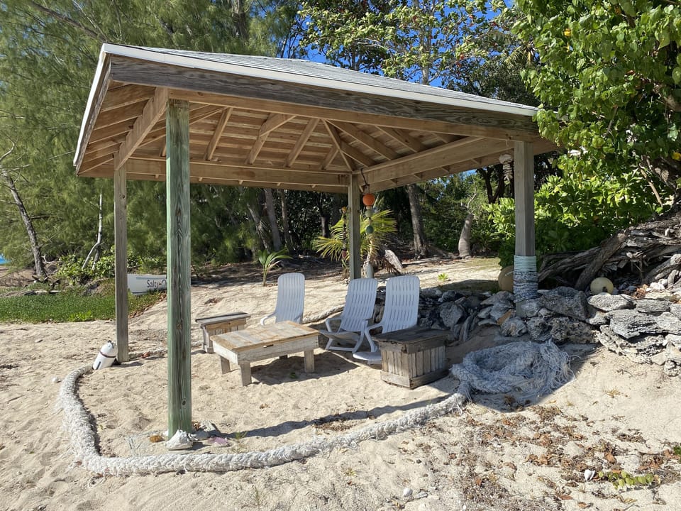 Tiki Dome provides seaside seating with loungers and calm sea breeze.