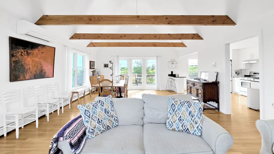 Cozy living room with dining area beyond