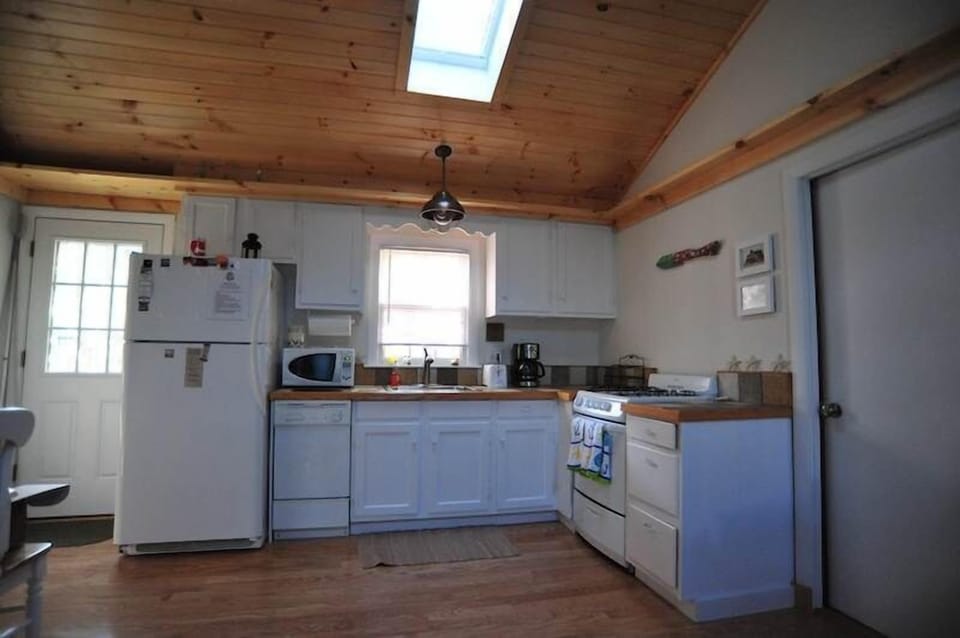 Full kitchen opens to living room
