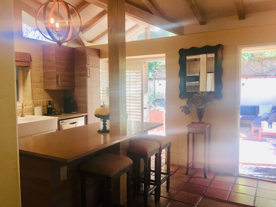 Kitchen open to living room and front patio 