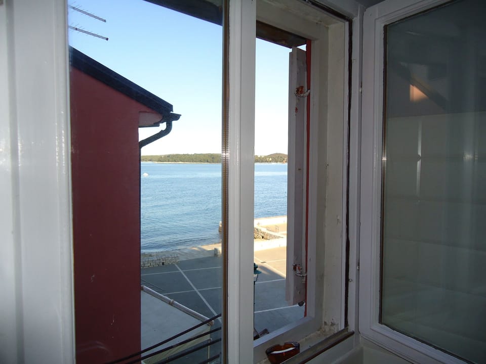 Preparing breakfast in the kitchen with the view of the Adriatic sea ..