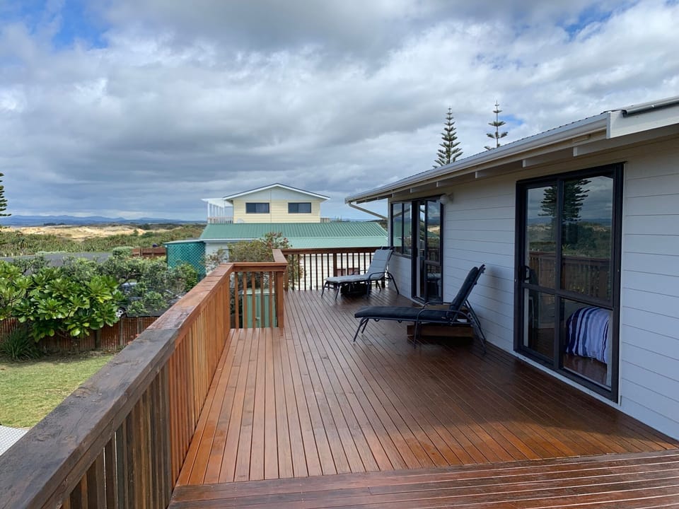 Lounge & Master bedroom  flow to deck with sweeping Doubtless Bay views