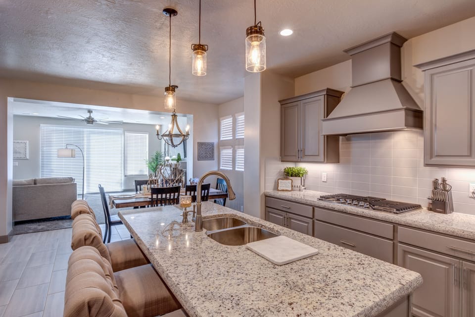 Kitchen View - The Kitchen is complete with everything you will need for meal preparations including pots, pans, baking dishes, plates, cups, silverware, cutlery, and an assortment of cooking utensils.