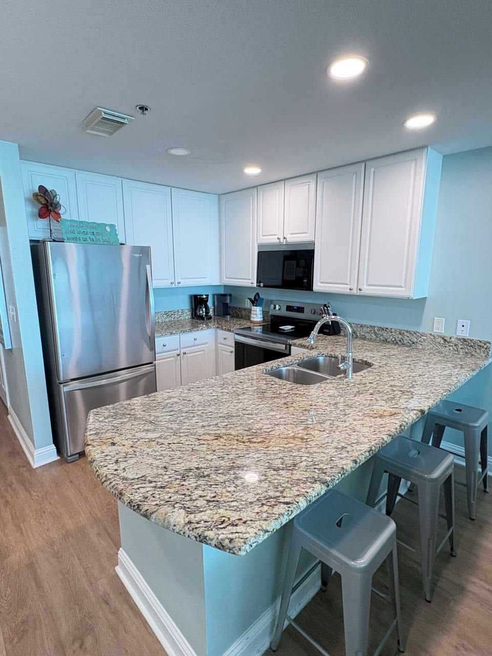 Updated kitchen with stainless steel appliances and granite countertops