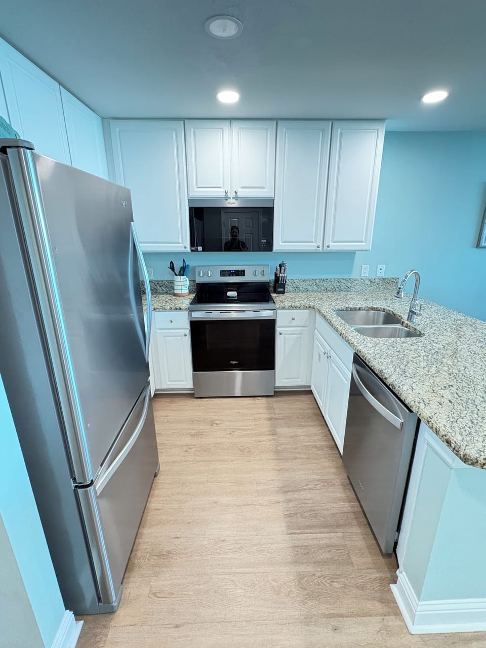 Updated kitchen with stainless steel appliances and granite countertops.