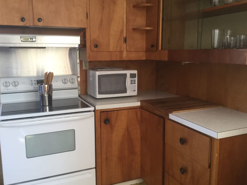 Kitchen with stove and microwave