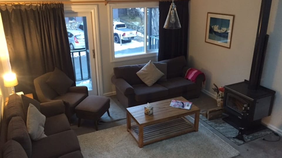 Lounge room with Fireplace & Balcony..