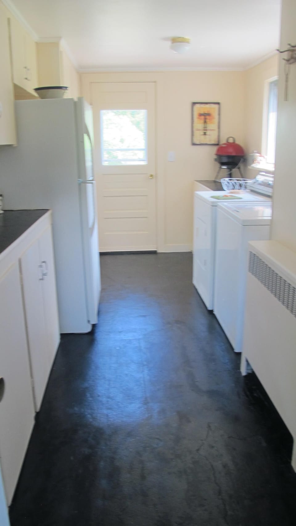 Pantry has washer & drier and plenty of storage space for grill, iron, food etc.