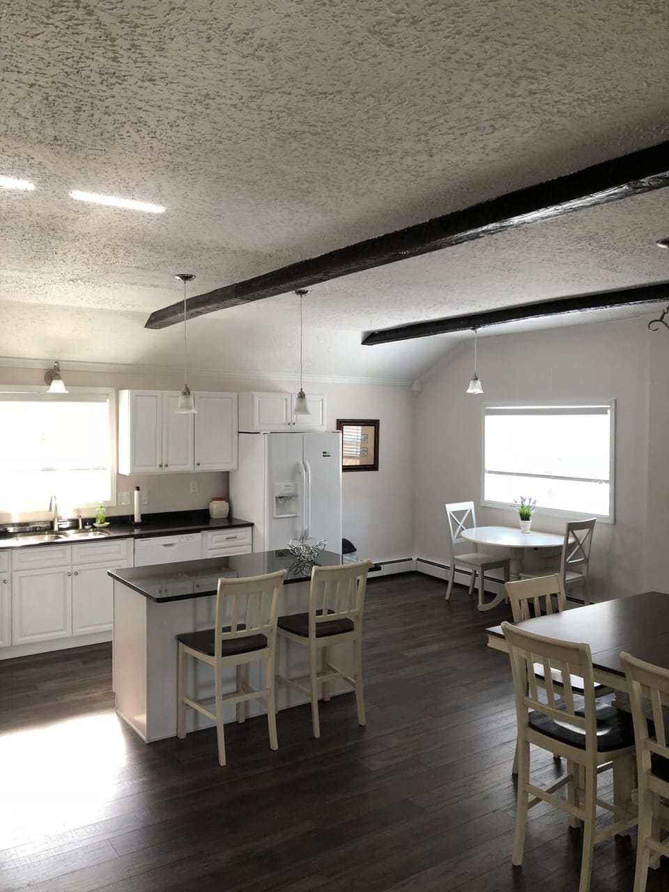 Kitchen with small table overlooking garden