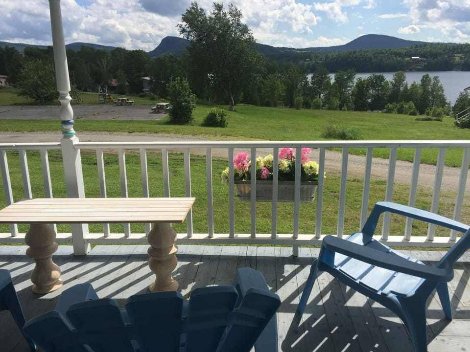 view of mountains and lake from porch