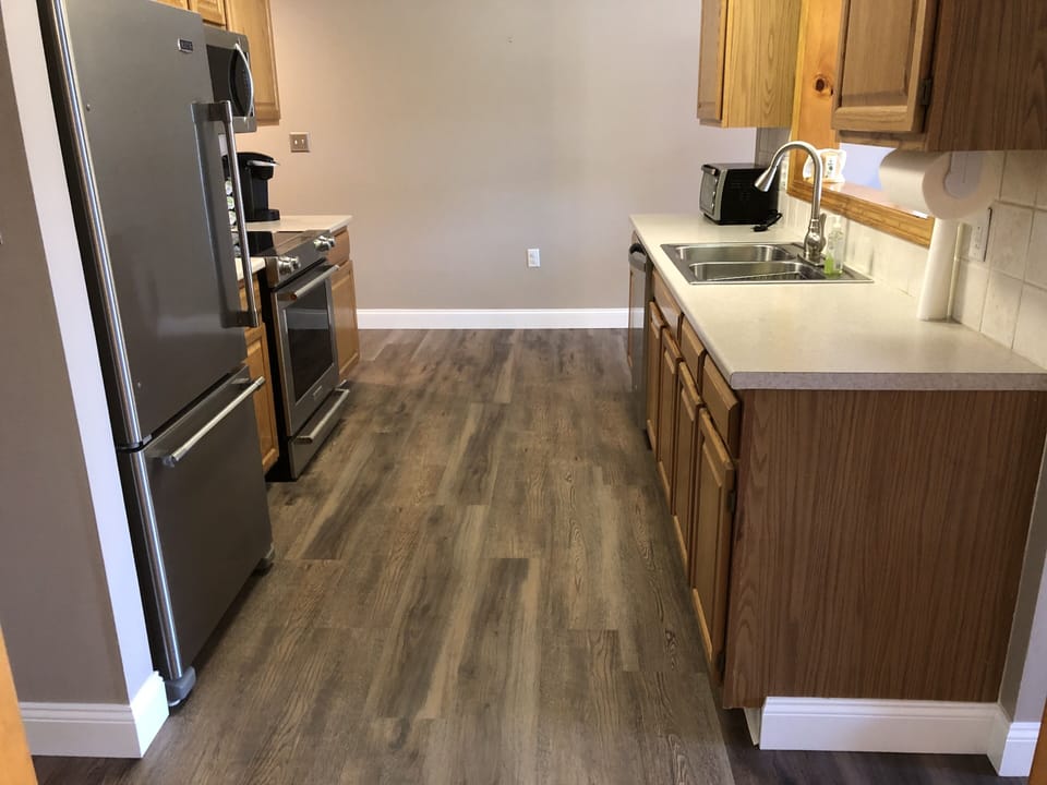 Full fridge, freezer, electric oven, microwave, toaster oven, and coffee options