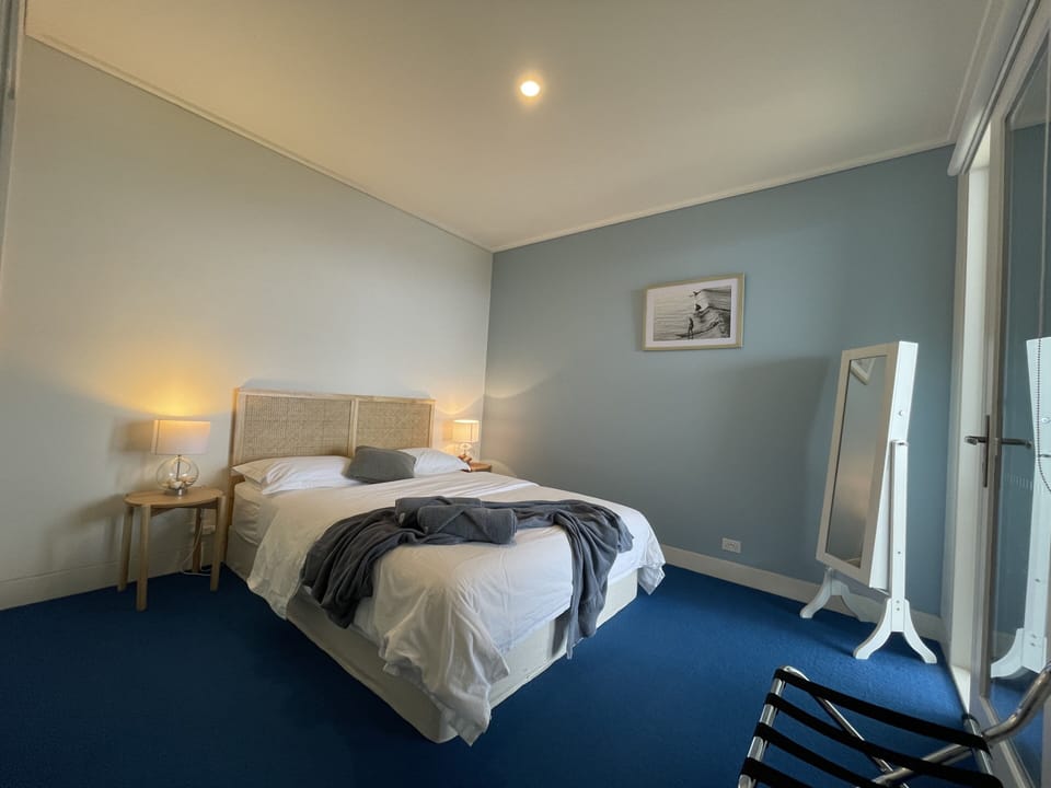 Second Bedroom with Queen Bed, Ocean Views and direct access to the balcony.
