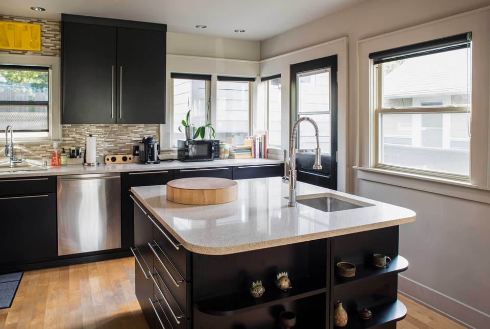 The kitchen comes fully equipped with stainless steel appliances.