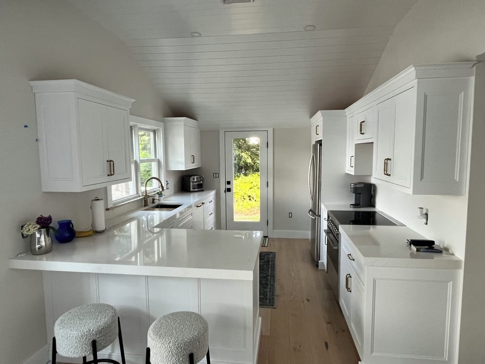 Kitchen area that leads to back deck 